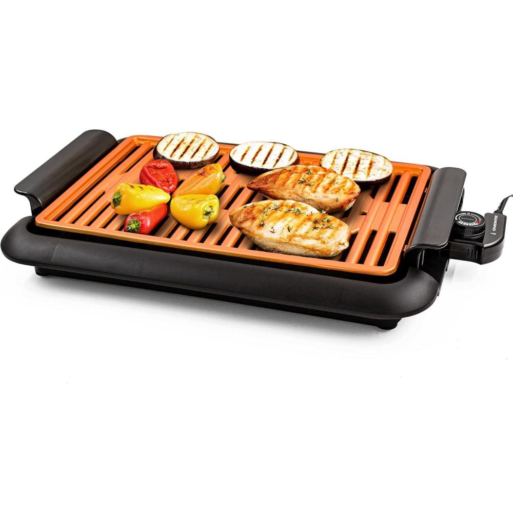 imageOVENTE Electric Indoor Grill with 13x10 Inch NonStick Cooking Surface 1000W Fast Heat Up Power Adjustable Temperature Removable and Dishwasher Safe Grilling Plate and Drip Tray Black GD1632NLBGD1510NLCO Copper